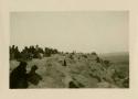 People on cliff at Acoma