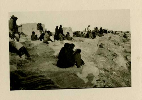 People sitting in village at Acoma