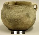 Ceramic complete vessel, one handle, incised design around rim