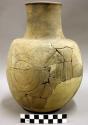 Ceramic complete vessel, mended, incised design around body