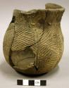 Ceramic partial vessel, mended, incised and cordage-impressed designs