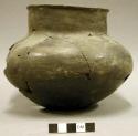 Ceramic partial vessel, mended, lip around rim