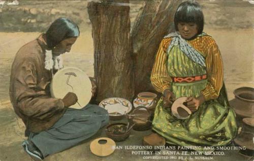 San lldefonso Indians painting and smoothing pottery in Santa Fe