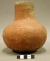 Ceramic vessel, medium neck, red slip, daub or burned earth and ochre inside