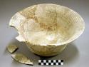 Ceramic bowl, flared rim, red on buff interior, reconstructed, 3 sherds inside