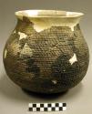 Corrugated pottery jar--restorable?