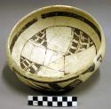 Restored jeddito black-on-yellow pottery bowl