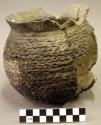 Ceramic partial jar, corrugated, flared rim, mended