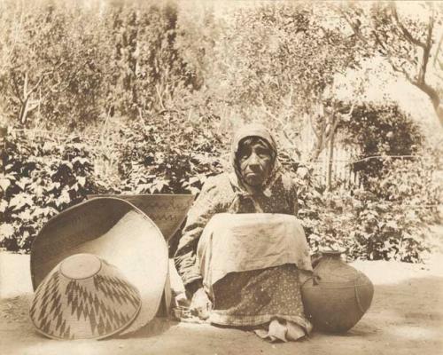 Old Martha Horton, woman with baskets and pottery