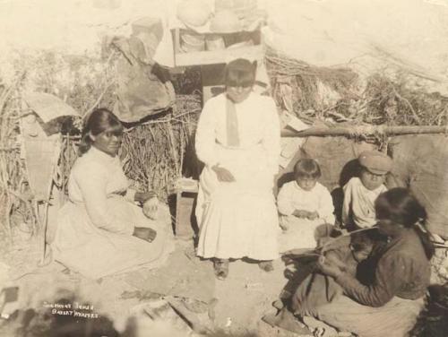 Group of women and children basket weavers