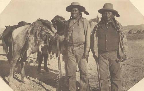 Chief McCook at left of Deer Hunter with load of meat