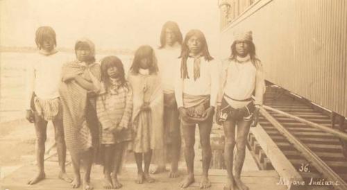 Group of people alongside railroad tracks