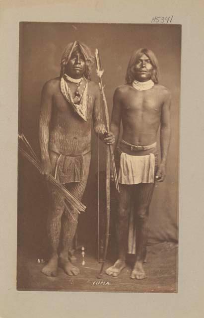 Full length studio portrait of two men