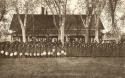 Large group of boys and girls (at day or boarding school?)