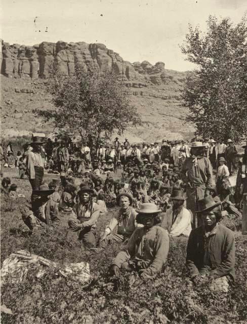 Many people, seated in valley