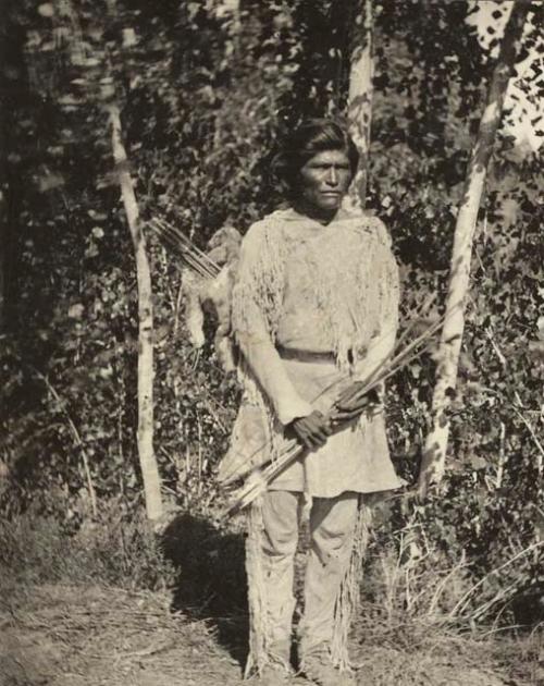 Man standing with arrows in his hand