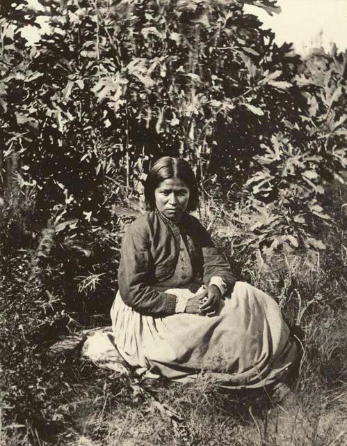 Woman seated on ground