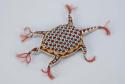 Turtle-shaped beaded amulet