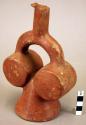 Red pottery jar, mouth on hollow handle