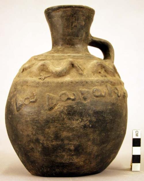 Pottery jar, handle on side, black, stamped ornament