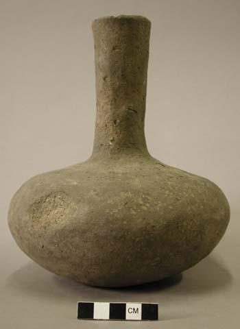 Ceramic vessel with long neck.