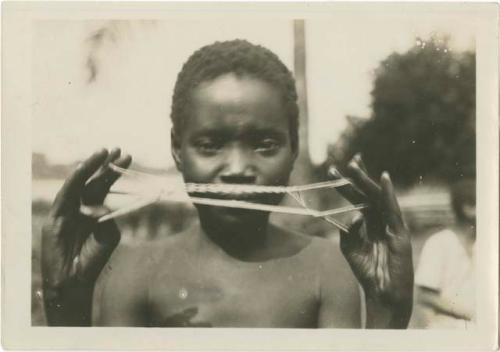 String figures from the Beligian Congo. "Firewood."