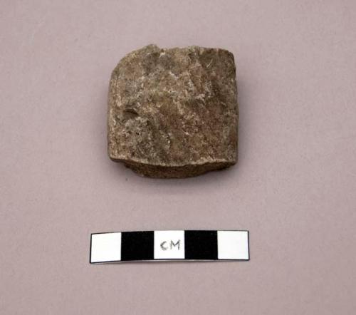 Ground stone, worked fragment