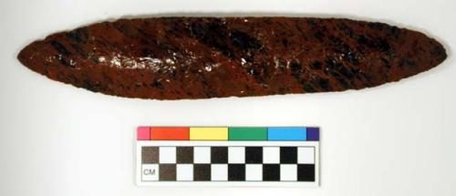 Chipped implement, red & black mottled obsidian