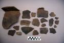 Ceramic, earthenware body and rim sherds, cord-impressed, grit-tempered; some sherds crossmended with glue; some sherds crossmend