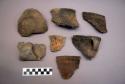 Ceramic, earthenware rim, body, handle, and lug sherds, some undecorated, some incised, some with possible Ramie design, some cord-impressed, some cord-impressed and incised, some punctate, some incised and punctate and cord-impressed, some with incised rim, some with molded rim, shell-tempered