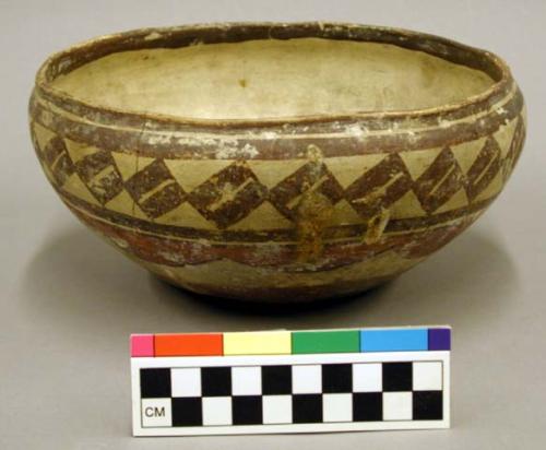 Polychrome pottery bowl - red, brown, yellow