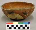 Polychrome pottery bowl - red, black, yellow.