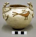 Small pottery bowl. Globular, white slip with brown and red, two frogs for lugs
