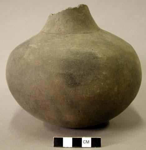 Ceramic complete vessel, broken at neck, plain, incised line around base of neck