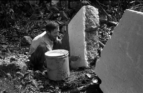 Pablo applying latex to stela at Machaquila