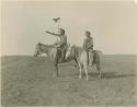 Whiteheaded Chief and Many Shot, on horseback