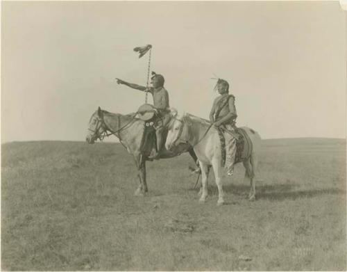 Whiteheaded Chief and Many Shot, on horseback