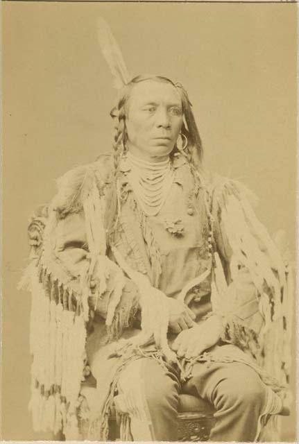 Studio portrait of Old Crow, a Mountain Crow Chief