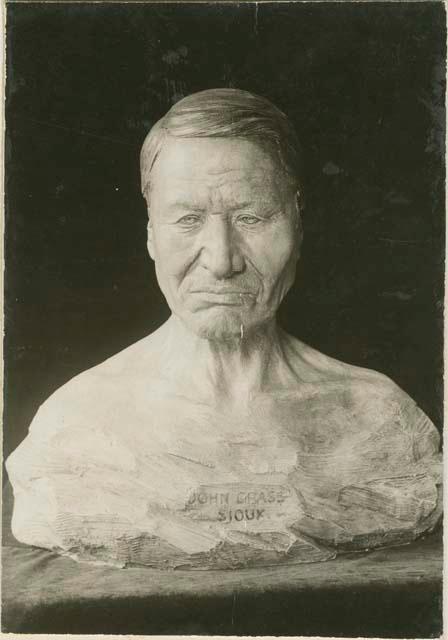 Studio photograph of carved bust of John Grass