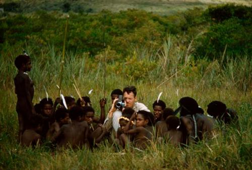 Robert Gardener surrounded by a group of boys