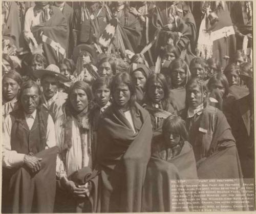 Group of Brules and Ogallala natives, including the grand children of Nelson, "No Neck," the Indian baby found on the Wounded Knee battlefield, and Mr. Geo. Crager (interpreter)