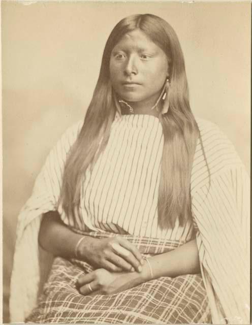 Studio portrait (to waist) of woman