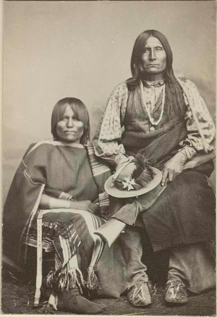 Full-length studio portrait of Trotting Wolf and his wife