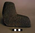 Ground stone metate fragment w/ leg, rough stone