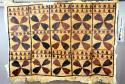 Tapa cloth with brown and black flower-like designs