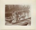 "Indians at portage between Fall and Basswood Lakes"