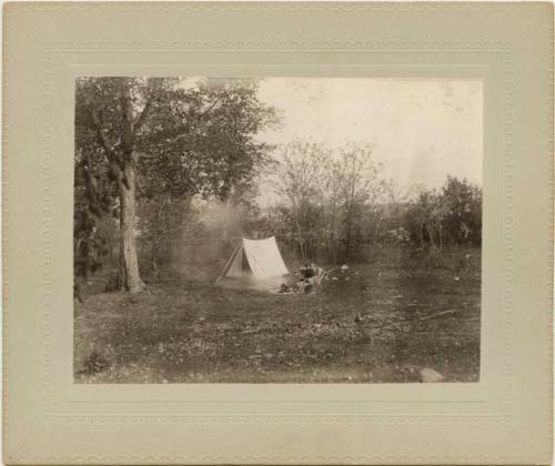 "Camp 2, with man next to tent."