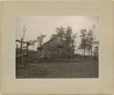 "Old bark house war camp 5. May 20, 1900."