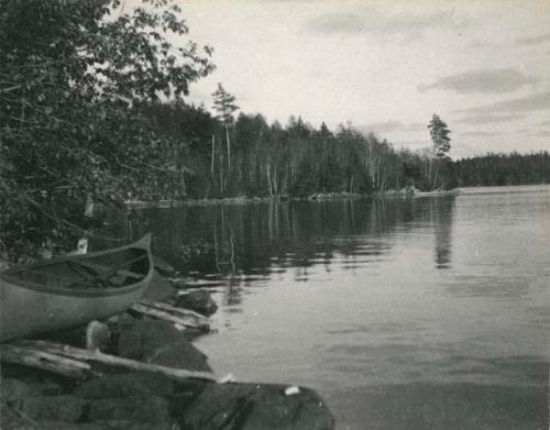 canoe on bank looking out onto the water