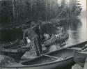 "Indians at portage between Fall and Basswood Lakes"